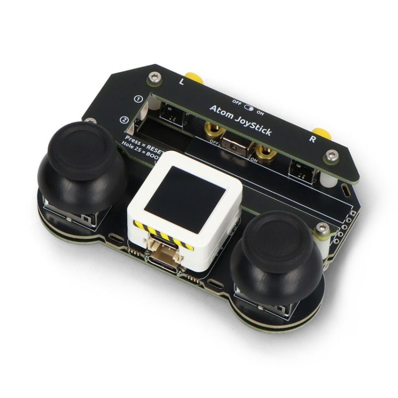 Programmerbar joystickkontroller med to svarte joystickspaker og sentralt display