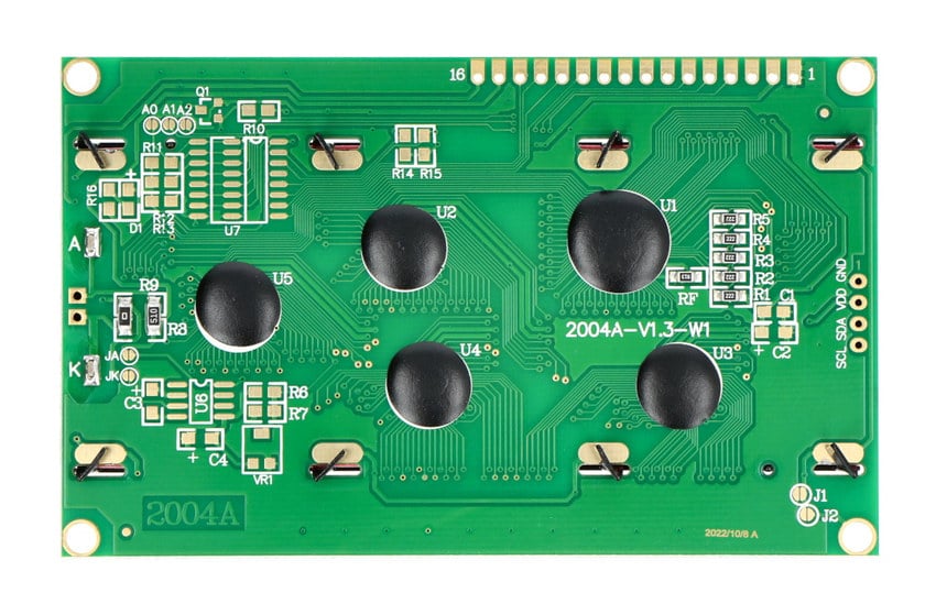Baksiden av det alfanumeriske LCD-modulet med kretskort og monteringshull