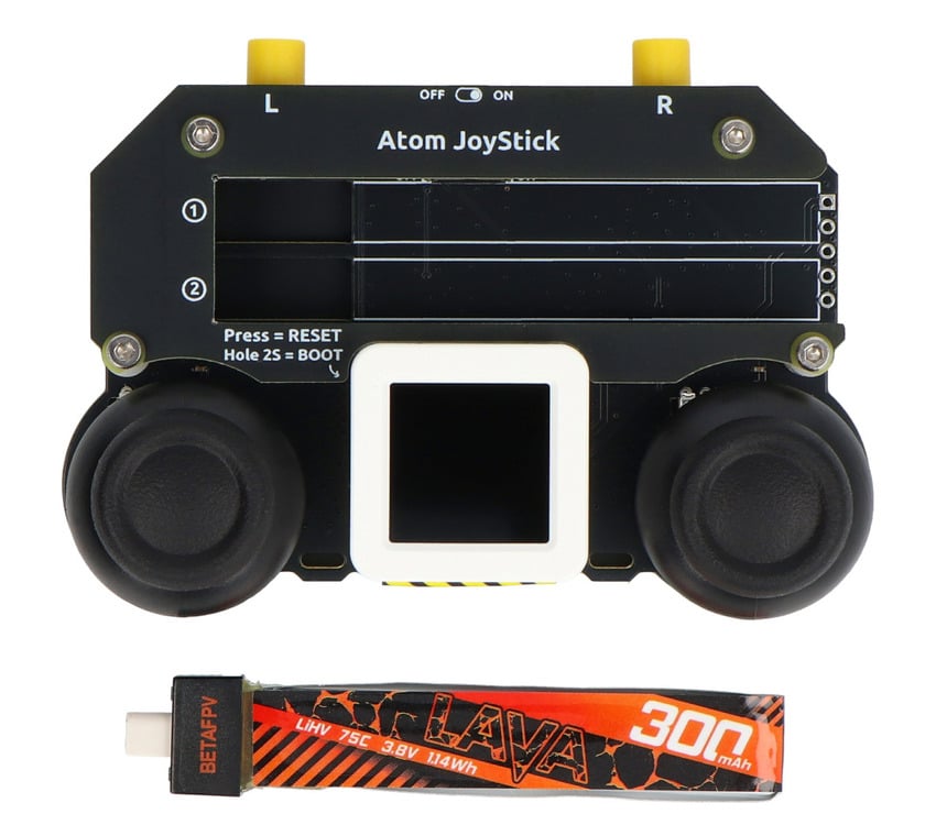 Joystickkontroller ovenfra med to styrespaker og separat batteri